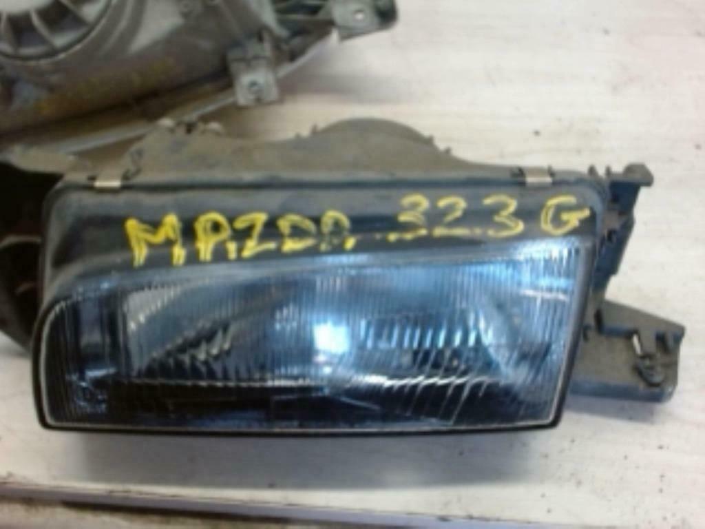 Optique avant principal gauche Mazda 323 I  (50703290), Enlèvement ou Envoi, Utilisé, Mazda