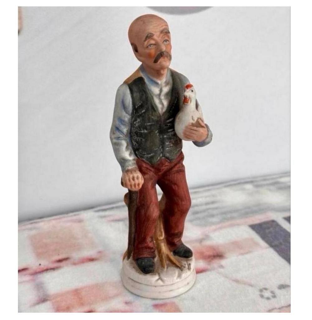 Figurine en porcelaine vintage 1990 Homme avec poulet 19CM, Enlèvement ou Envoi, Comme neuf, Humain