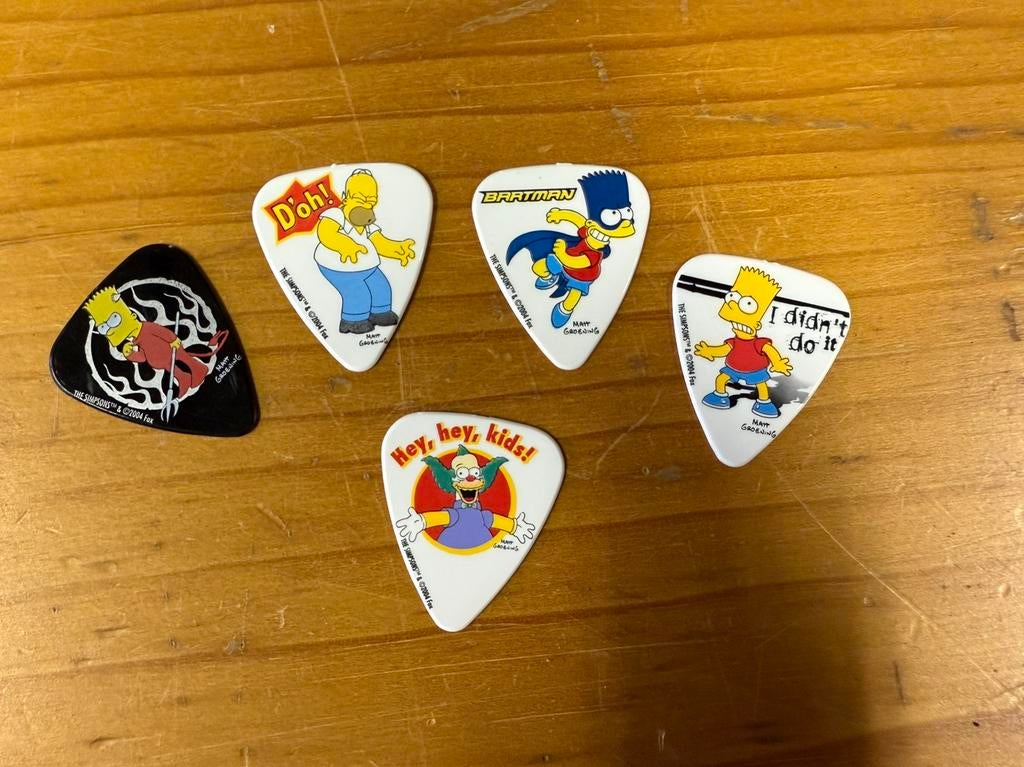 5 plectrums The Simpsons, Muziek en Instrumenten, Ophalen of Verzenden, Nieuw, Akoestische gitaar