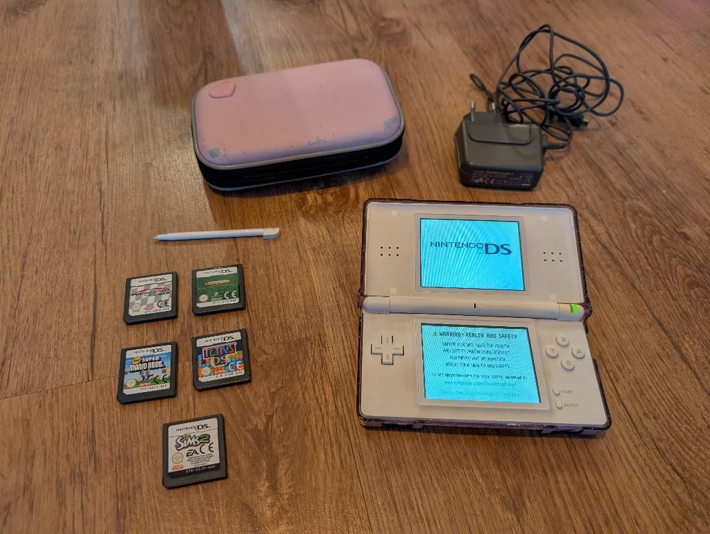 Nintendo DS lite met spelletjes, Games en Spelcomputers, Gebruikt, Ophalen of Verzenden, Roze, Met beschermhoes of tas
