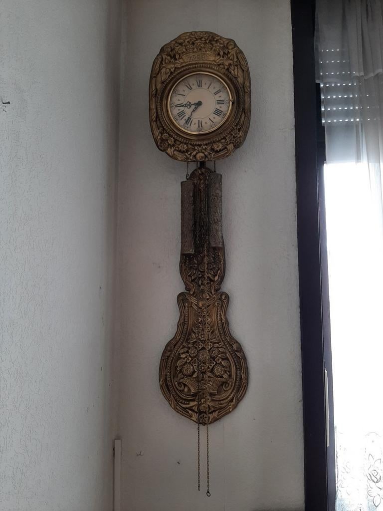 Antieke hangklok, Ophalen