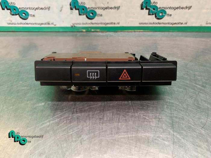 Commutateur éclairage d'urgence d'un Daihatsu Cuore (Cuore, Daihatsu, -, 3 mois de garantie, Utilisé