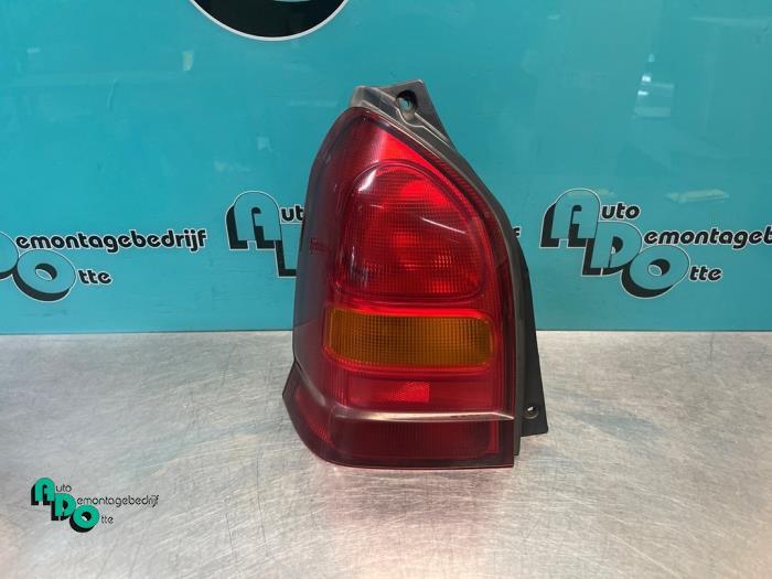 Feu arrière gauche d'un Suzuki Alto (Alto 02-), -, 3 mois de garantie, Utilisé, -