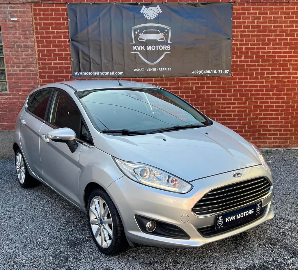 Ford Fiesta 2016 1.0i Titanium **Garantie 12 mois**, Voorwielaandrijving, Testrit aan huis, Stof, https://public.car-pass.be/vhr/c13832ff-bb23-4c20-9cba-b98de709366e