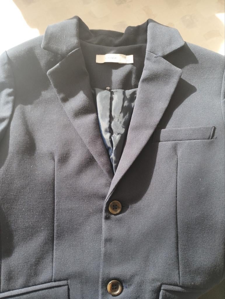 Communie vest Name it, Ophalen