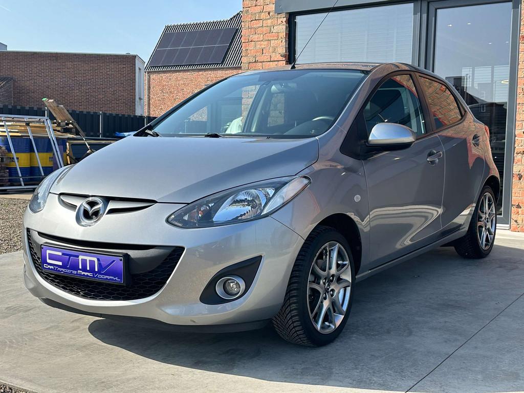 Mazda 2 1.3i 5dr Airco - Navi - Trekhaak - 1ste Eigenaar!, Auto's, Mazda, Euro 5, Stof, Gebruikt, Zwart