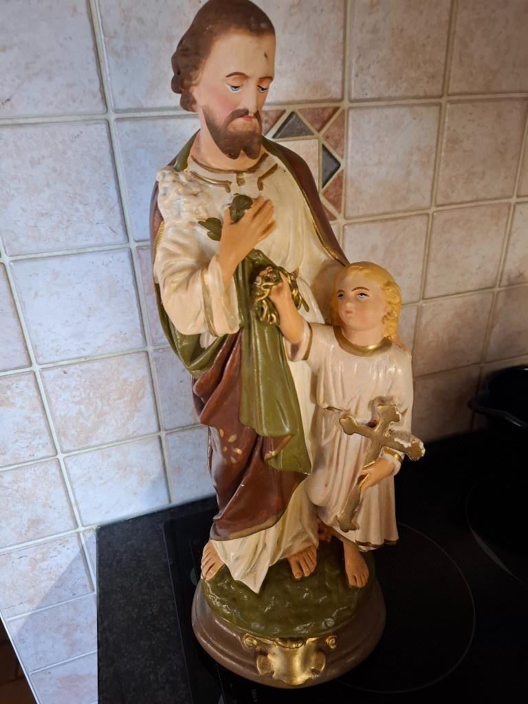 heiligenbeeld met stolp, Ophalen