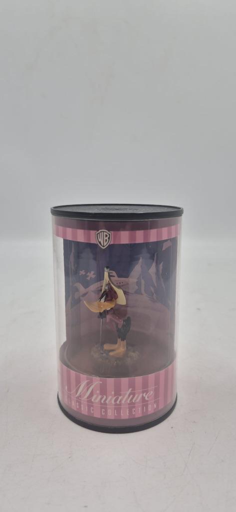 Figurine miniature Taz dans boîte cylindrique, Enlèvement