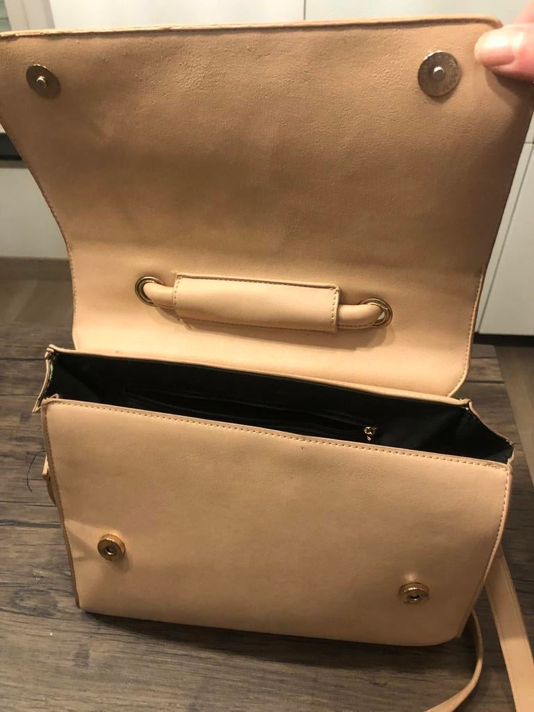 Handtas, Ophalen, Zo goed als nieuw