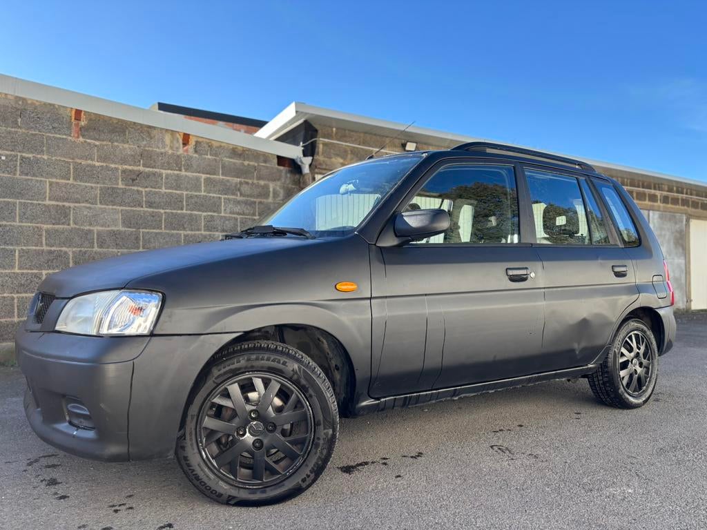 Mazda Demio - 1.4 Benzine - 176 000 Km - Gekeurd, Auto's, Voorwielaandrijving, Stof, Zwart, Demio