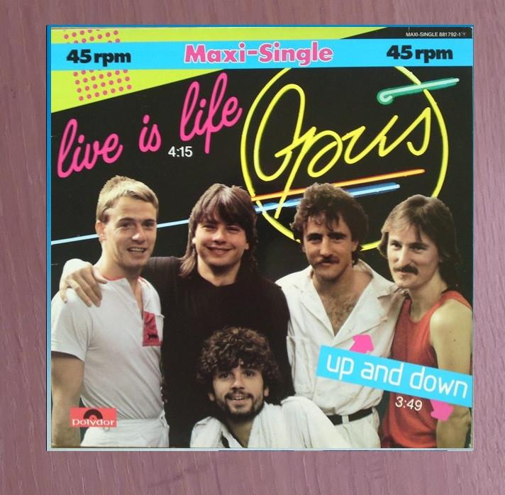 12" Maxi -  Opus ‎– Live Is Life, Cd's en Dvd's, Vinyl | Rock, Ophalen of Verzenden, Gebruikt, 12 inch, Poprock