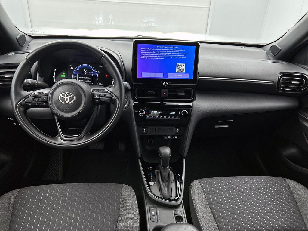 Toyota Yaris Cross 1.5 VVT-ie Hybrid 85kW Dynamic Plus CVT, Auto's, Toyota, Stof, Gebruikt, 750 kg, Overige kleuren
