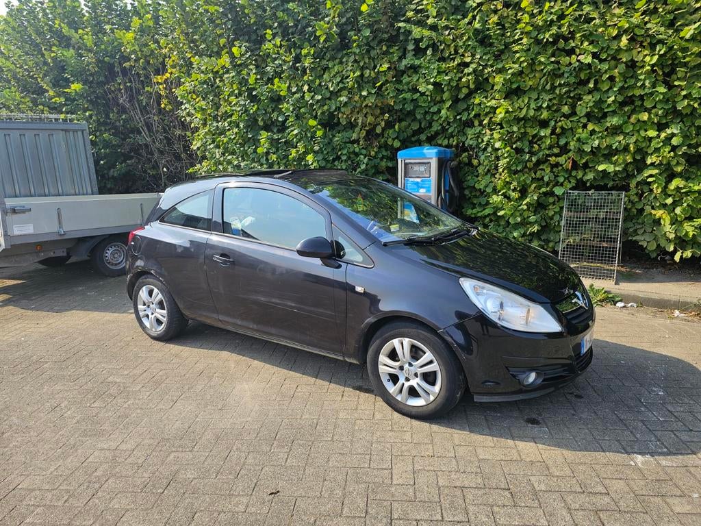 Opel Corsa 1.2 Benzine 2009, 
160000 km., Auto's, Opel, Elektrische ramen, Zwart, Handgeschakeld, Particulier