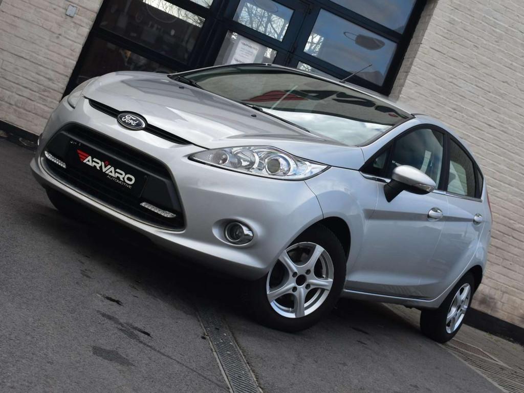 Ford Fiesta 1.25i Xenon / Verw Zetels / Airco / Garantie, Voorwielaandrijving, Euro 5, Stof, Gebruikt