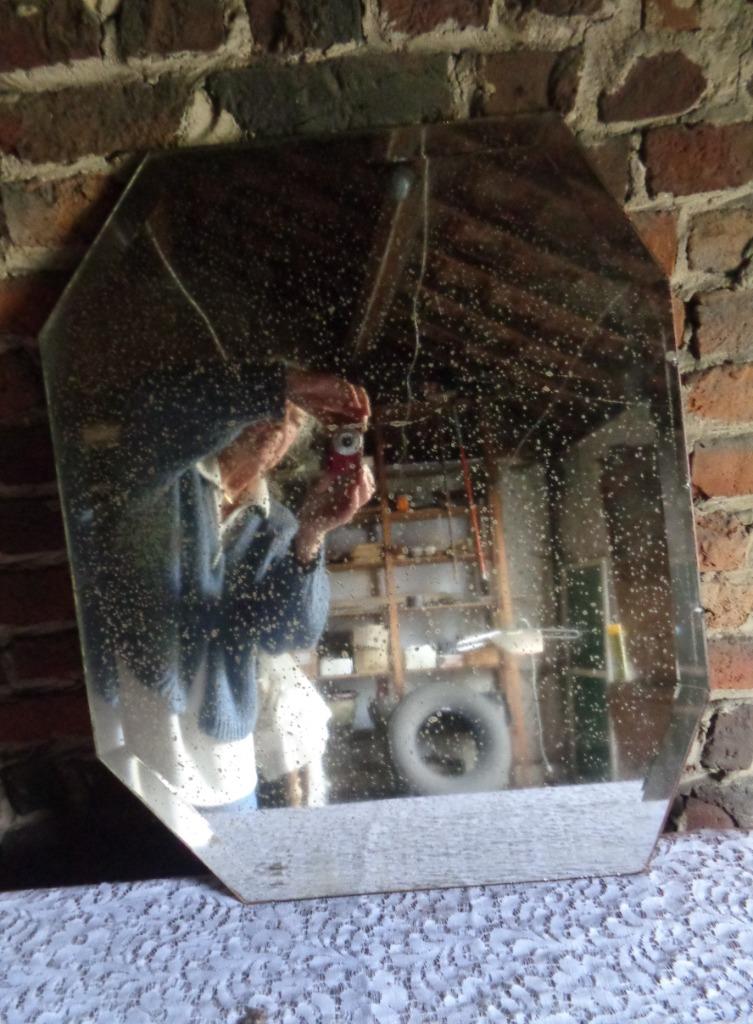 Gebisoteerde spiegel met ouderdom stippeltjes, Ophalen