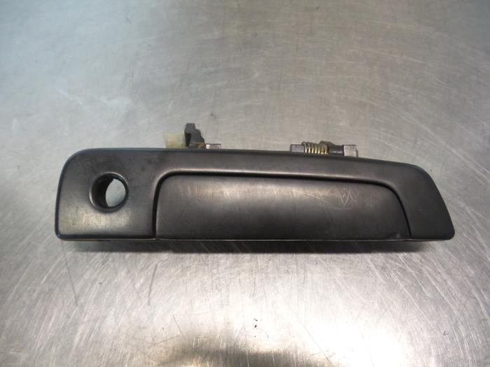 Poignée portière 2portes droite d'un Mitsubishi Colt (Colt, -, Utilisé, Mitsubishi, -