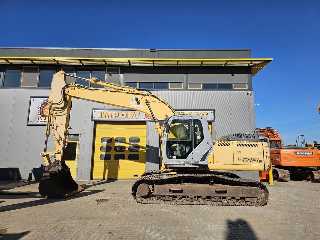 Kobelco New Holland E215 WE1665, Articles professionnels, Machines & Construction | Grues & Excavatrices, Excavatrice
