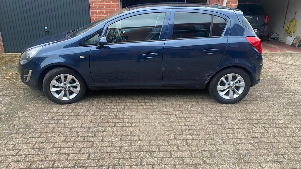 Opel Corsa 1.2 benzine, Auto's, Opel, Euro 5, Zwart, Blauw, Leder en Stof