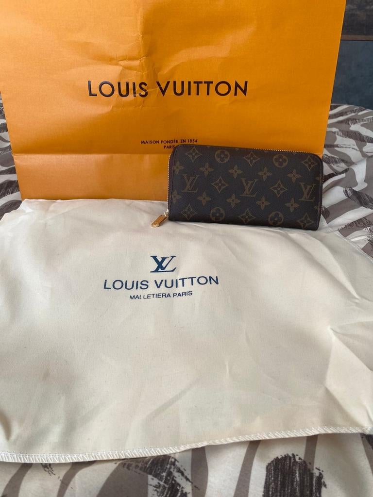 Louis vuitton zippy, Ophalen of Verzenden