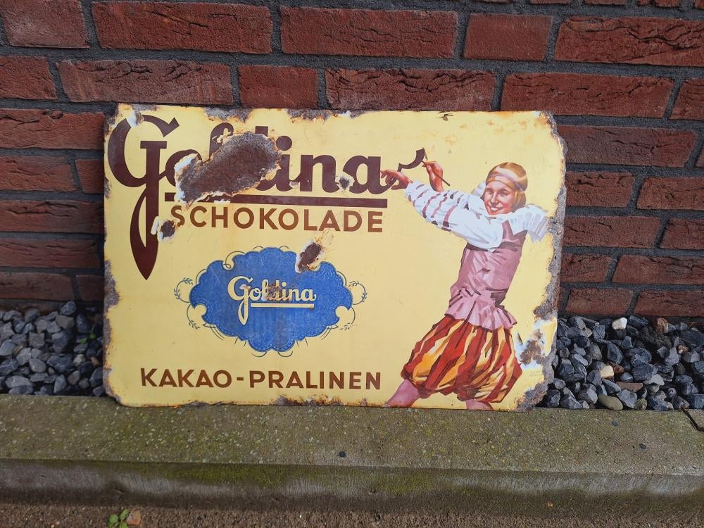 Antiek emaille gebold bord van Goldina-chocolade uit 1915., Ophalen of Verzenden, Gebruikt, Reclamebord