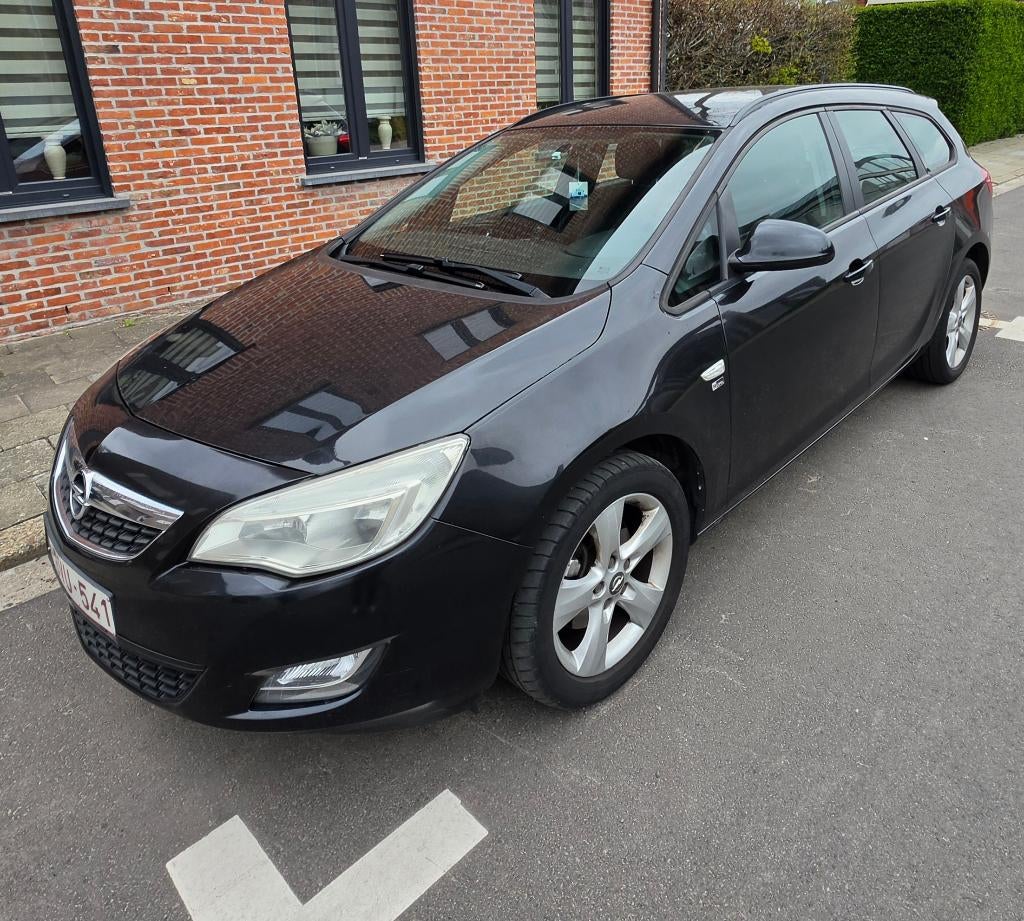 Opel astra sports tourer, Auto's, Opel, Voorwielaandrijving, Euro 5, Zwart, Leder en Stof