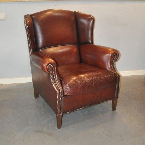 Schapenleren oorfauteuil Muylaert, Antiek en Kunst, Ophalen