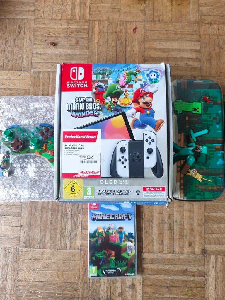 Switch oled + manette + jeux + valisette + garantie ., Enlèvement, Comme neuf, Switch OLED