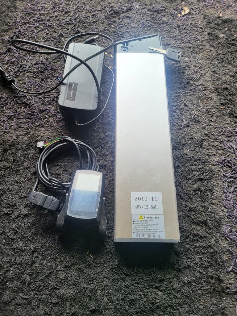 Baterij en display en oplader, Enlèvement