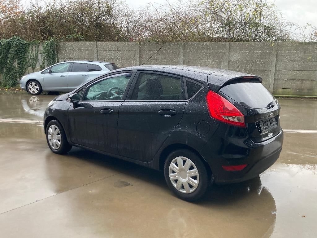 Ford Fiesta 1.3 benzine 2011 met 121000km*airco*garantie, Auto's, Euro 5, Electronic Stability Program (ESP), 4 cilinders, Leder en Stof