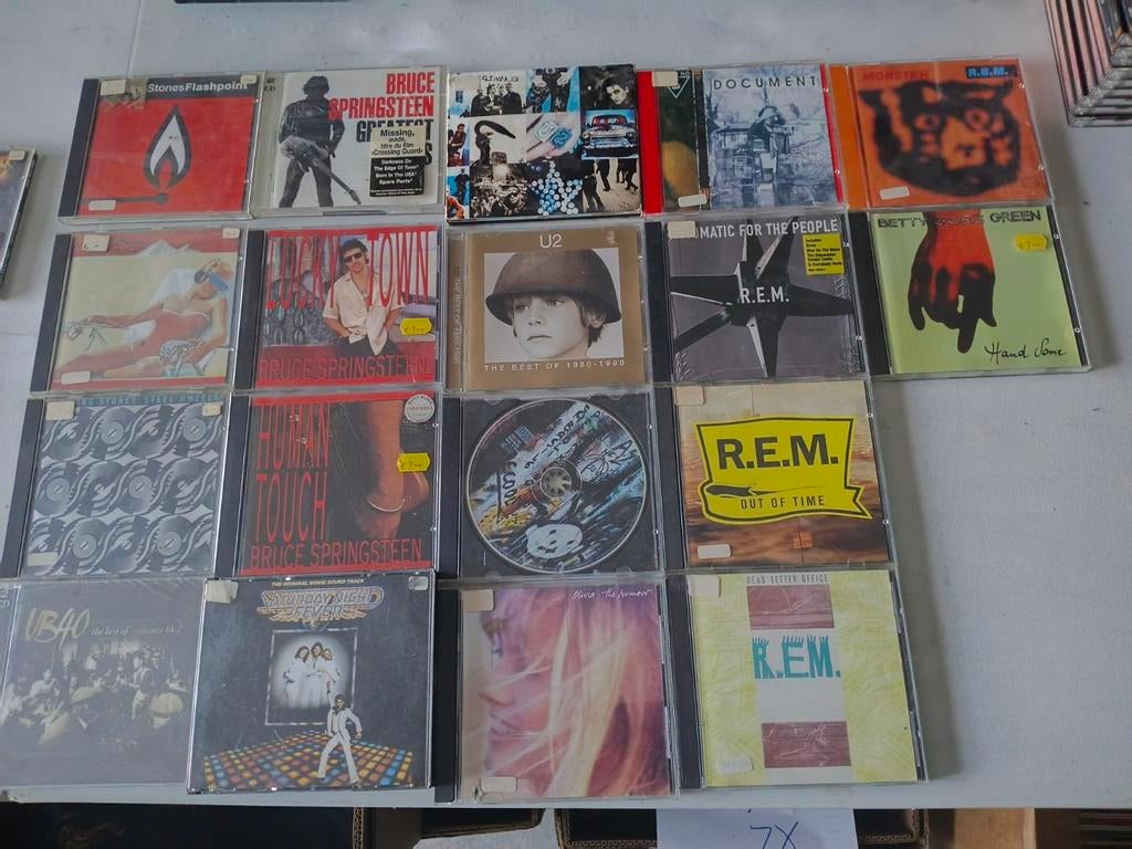 18 tal cd's van Rolling Stones tot U2..., Ophalen