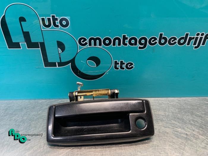 Poignée hayon d'un Mitsubishi Lancer (Lancer 03-) (X42), -, 3 mois de garantie, Utilisé, Mitsubishi