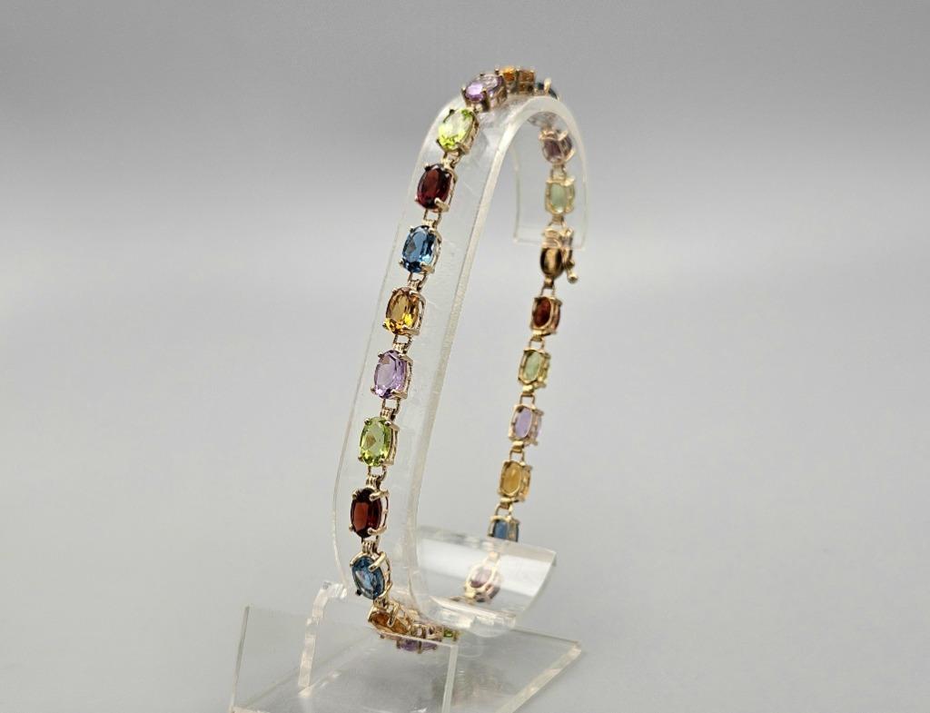 Gouden Vintage tennisarmband met edelstenen. 2025/361, Overige kleuren, Ophalen of Verzenden, Zo goed als nieuw, Met edelsteen