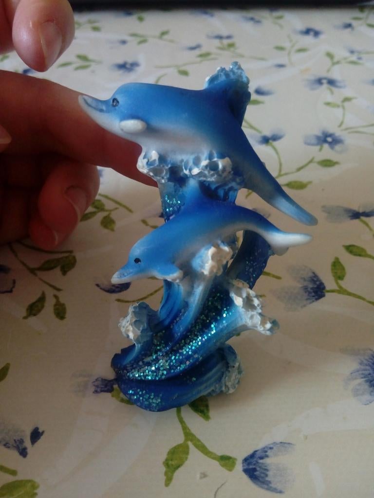 Dolfijnen beeldje, Ophalen