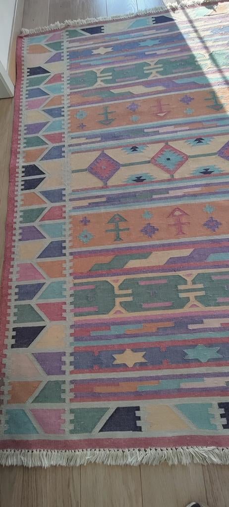 Handgeweven katoenen tapijt, Ophalen