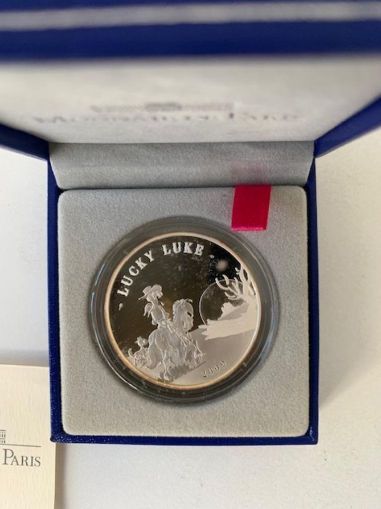 Lucky Luke - 10 euro - 2009 - Monnaie de Paris, Collections, Enlèvement ou Envoi, Autres personnages, Neuf, Ustensile