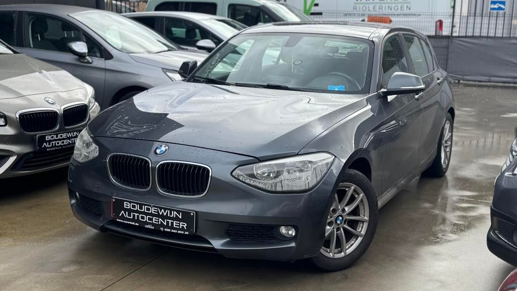 Bmw 1 Serie 1.6Benzine AUTOMAAT 2011 170.xxxkm Topstaat, Automaat, Zwart, 5 deurs, https://public.car-pass.be/vhr/61240180-234f-4c4d-94f5-52f9d5f55593