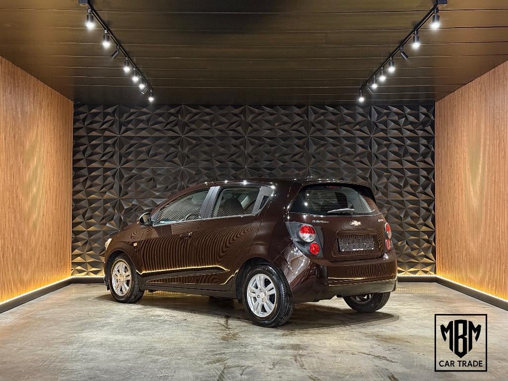 ✅ Chevrolet Aveo 1.2i 12 Maand GARANTIE Airco Cruise Control, Auto's, Chevrolet, Voorwielaandrijving, Euro 5, Stof, 4 cilinders