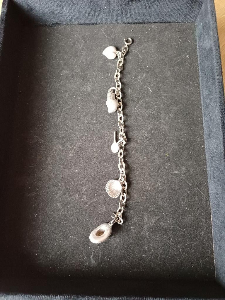 Zilveren bedelarmband met 5 bedels, Ophalen