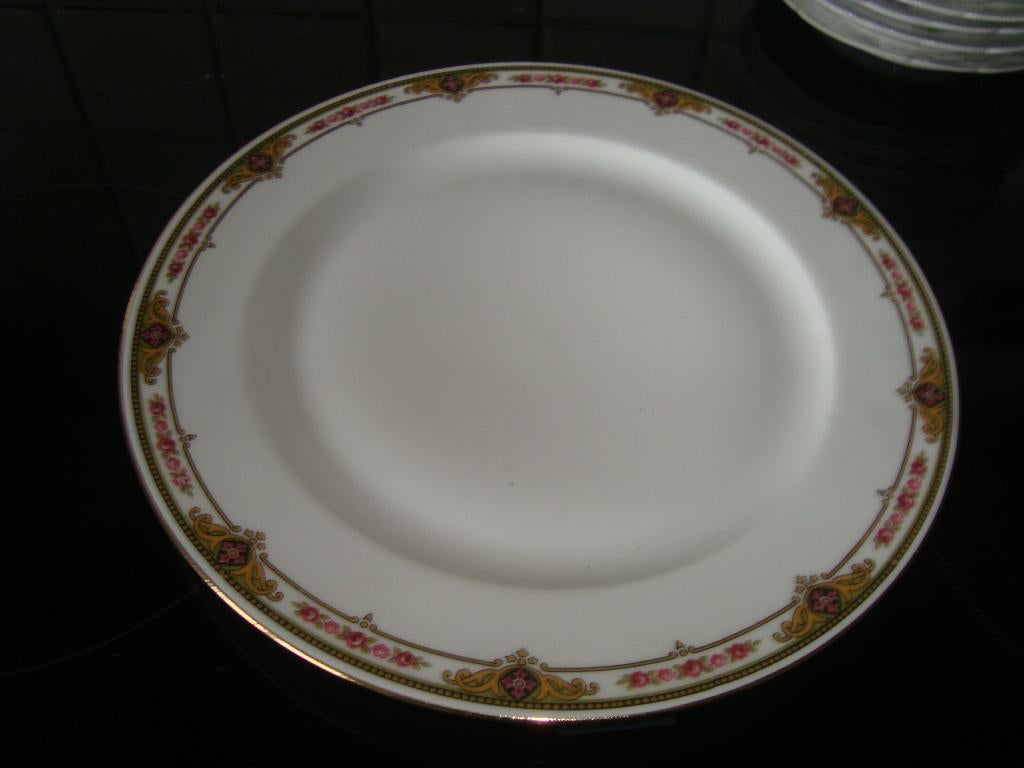 12 Platte borden in Limogesporselein., Ophalen