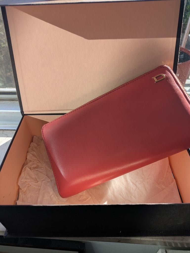 belle delvaux portefeuille, Enlèvement