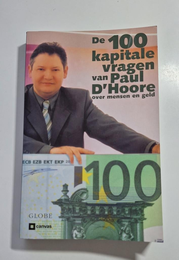 De 100 kapitale vragen van Paul d'hoore over mens en geld, Boeken, Ophalen of Verzenden, Zo goed als nieuw