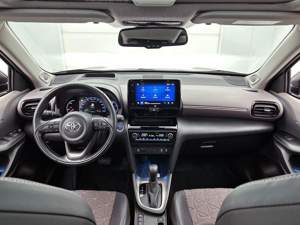Toyota Yaris Cross 1.5 VVT-ie Hybrid Elegant Bi-Tone CVT, Auto's, Toyota, Stof, Gebruikt, 750 kg, Overige kleuren