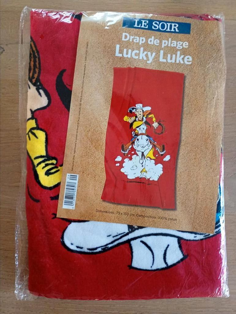 Lucky Luke strandlaken 75 X 150 cm nieuw, Verzamelen, Stripfiguren, Ophalen of Verzenden, Overige figuren, Nieuw, Kleding