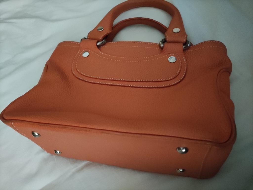 Mandarine color bag in leather with extra handle, Handtassen en Accessoires, Tassen | Damestassen, Ophalen of Verzenden, Zo goed als nieuw