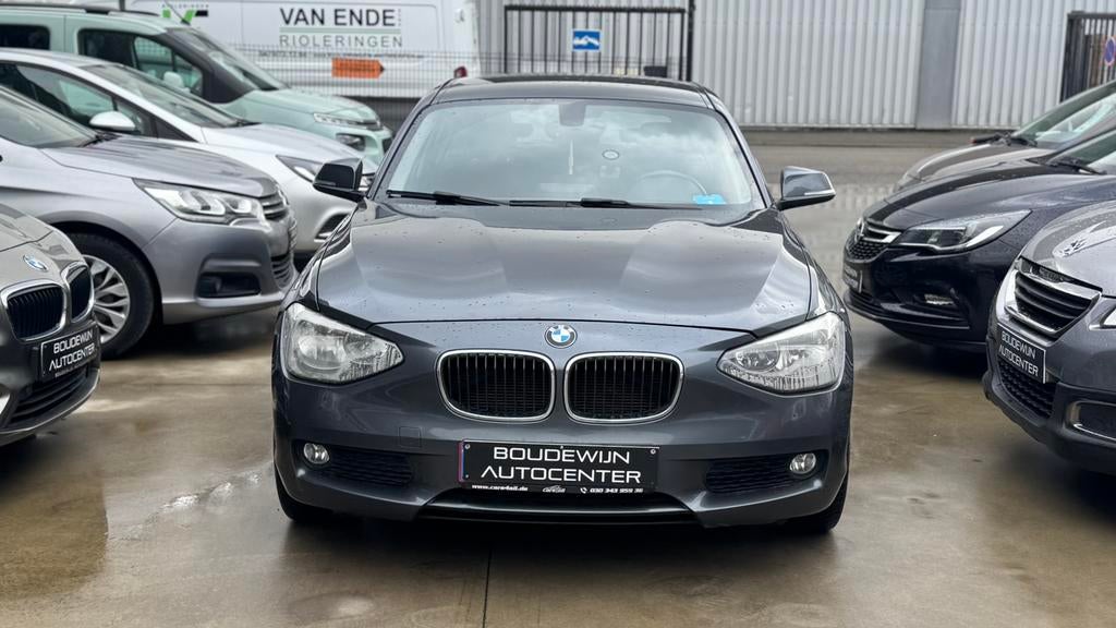 Bmw 1 Serie 1.6Benzine AUTOMAAT 2011 170.xxxkm Topstaat, Automaat, Zwart, 5 deurs, https://public.car-pass.be/vhr/61240180-234f-4c4d-94f5-52f9d5f55593