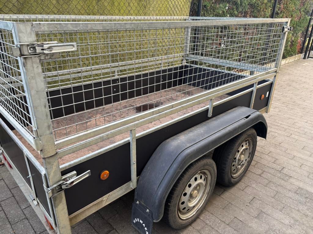 Aanhangwagen dubbelasser met loofrekkem, Ophalen, Gebruikt