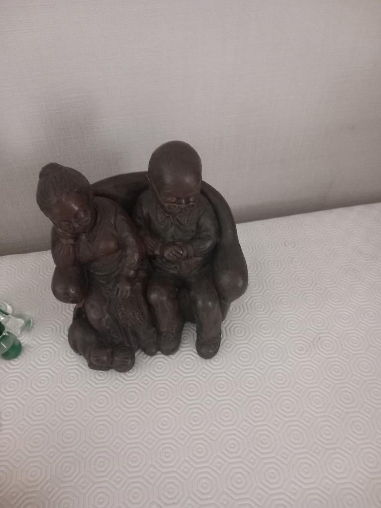 Zeer zwaar beeltje koppel, Ophalen