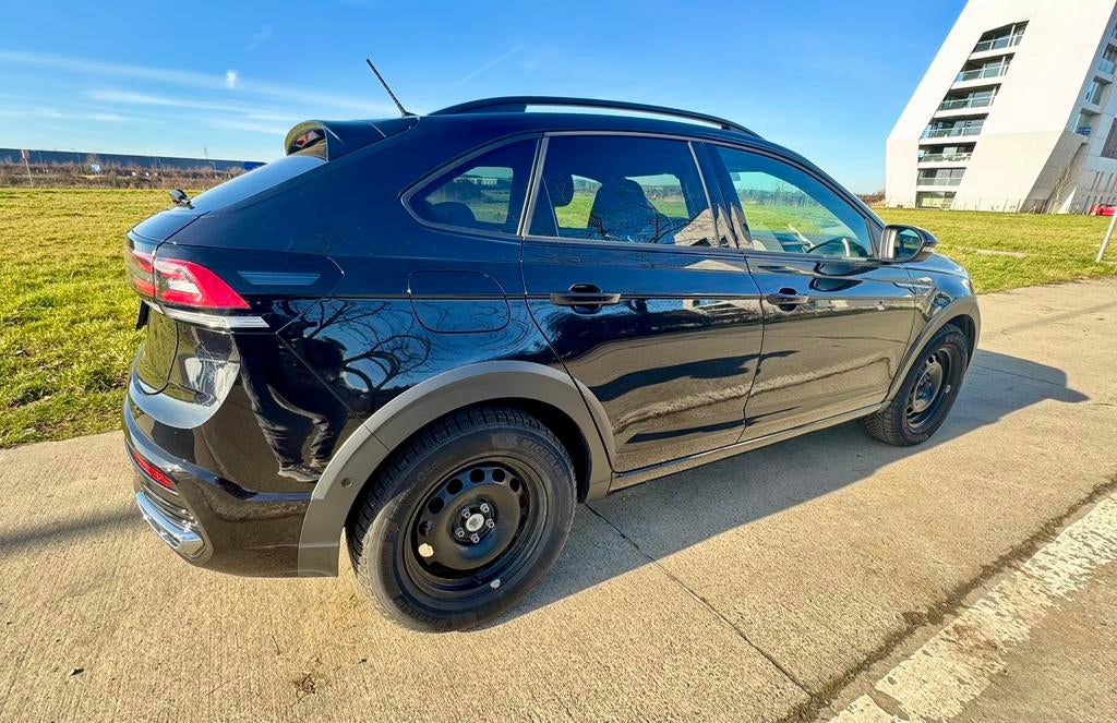 Volkswagen Taigo 1.0 Tsi R-Line boîte manuelle 2023, Auto's, Volkswagen, Voorwielaandrijving, Stof, Euro 6, Zwart