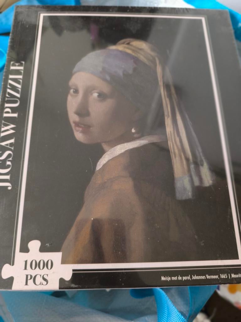 Nieuwe puzzel Meisje met de parel, Ophalen