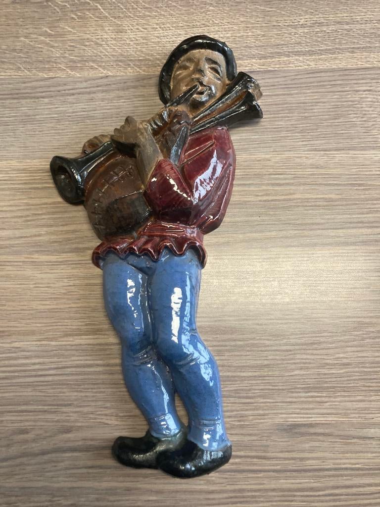 Doedelzakspeler in keramiek, Ophalen